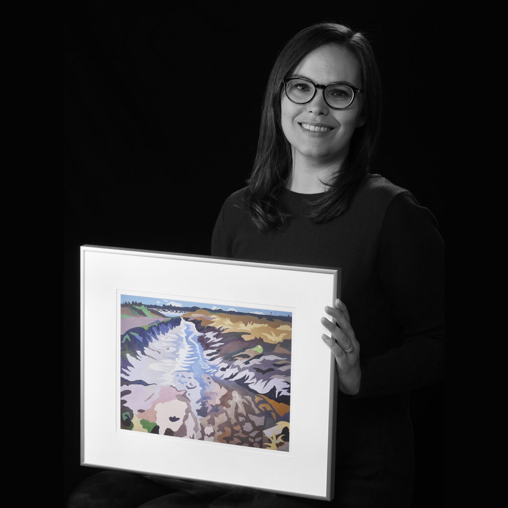 Emily Phillips holding artwork